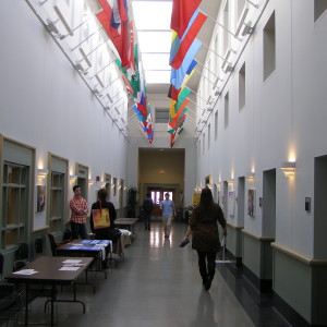 BEFORE: Imagine what this corridor feels like to a 9 year old with autism - can't see into the spaces, feels foreboding, only small openings, light at top but dark where you are navigating