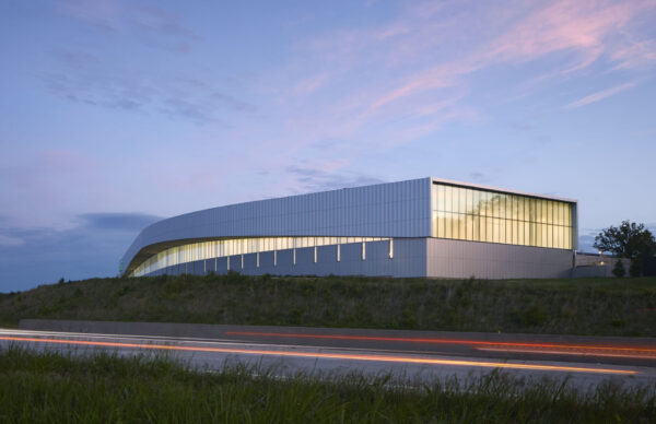 Exterior of the Missouri Protoplex at Missouri S&T at dusk, featuring the illuminated upper-level façade.